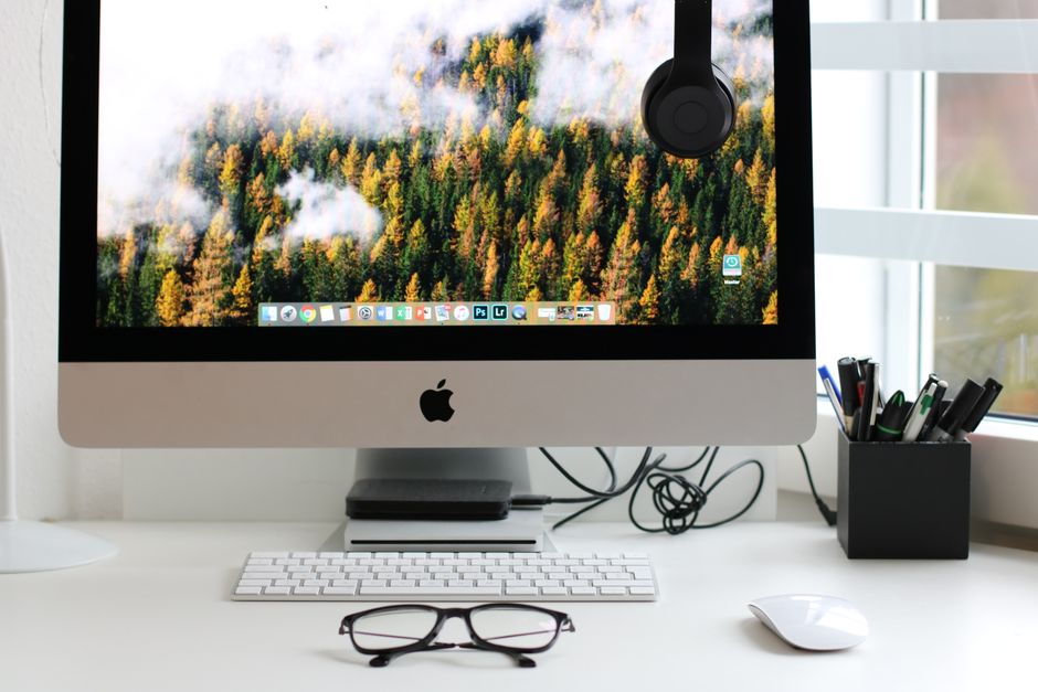 Stylish home office workspace featuring a computer setup with accessories.